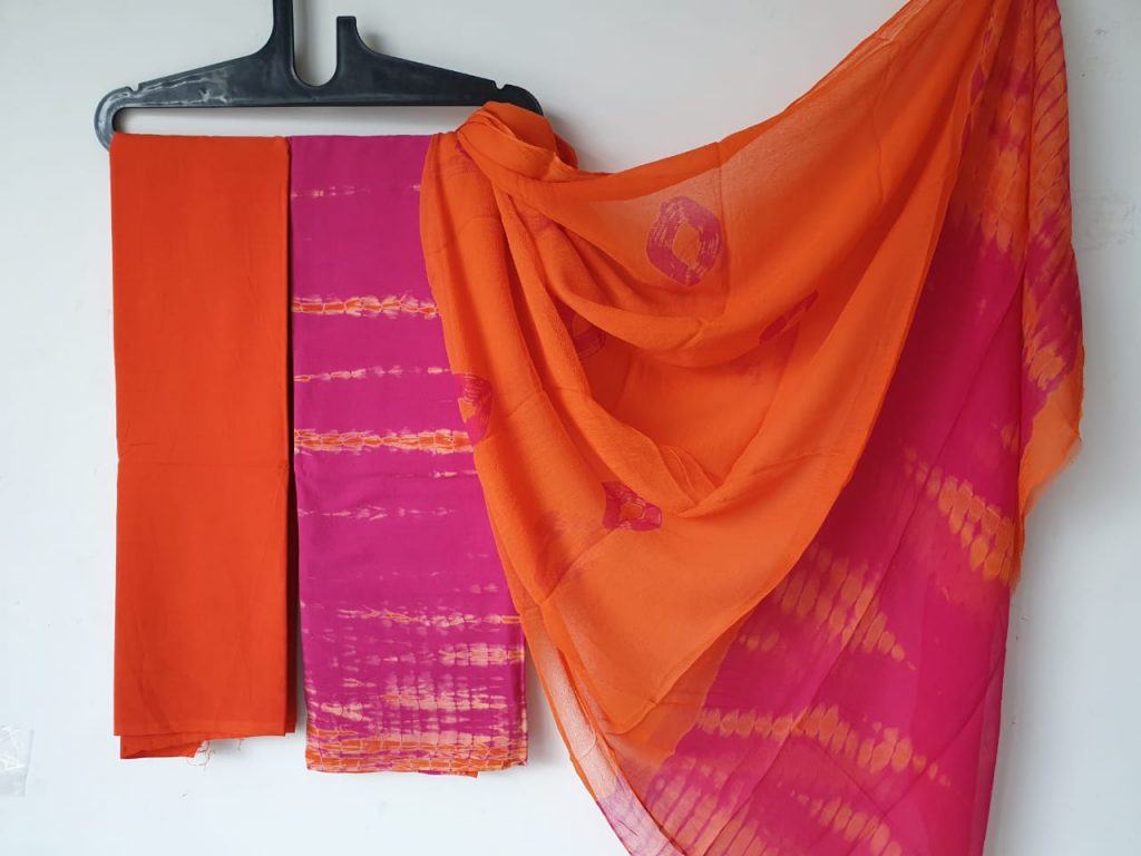 Unstitched orange tie n dye print cotton salwar kameez with chiffon chunni