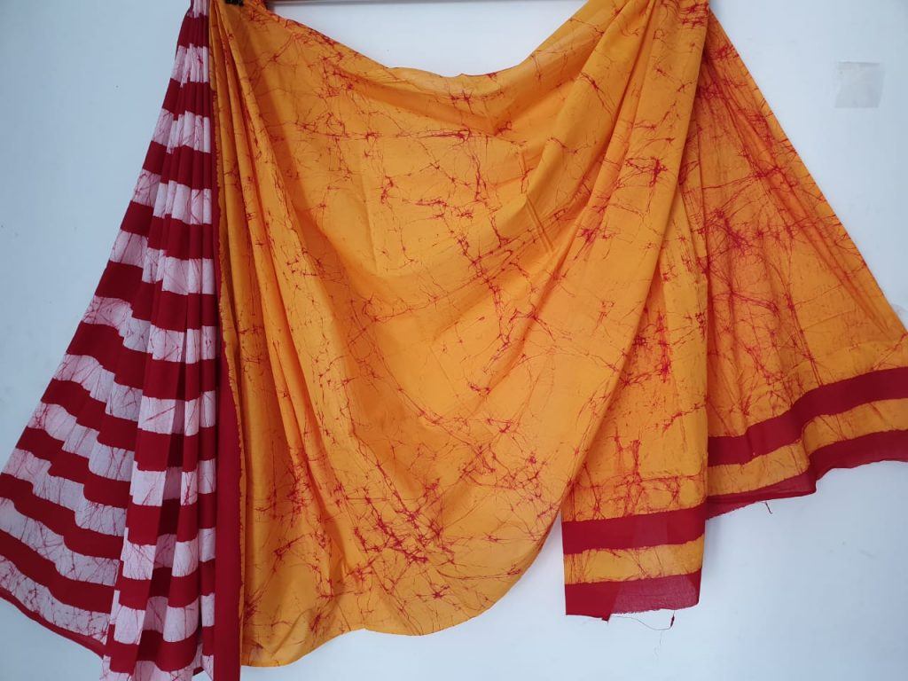 Beautiful yellow batik print Pure malmal saree with blouse
