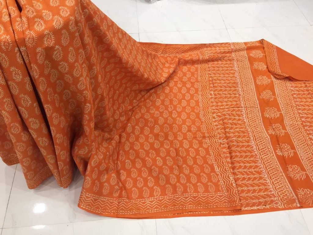 Discharge orange regular wear kerry bagru print cotton sarees with blouse piece