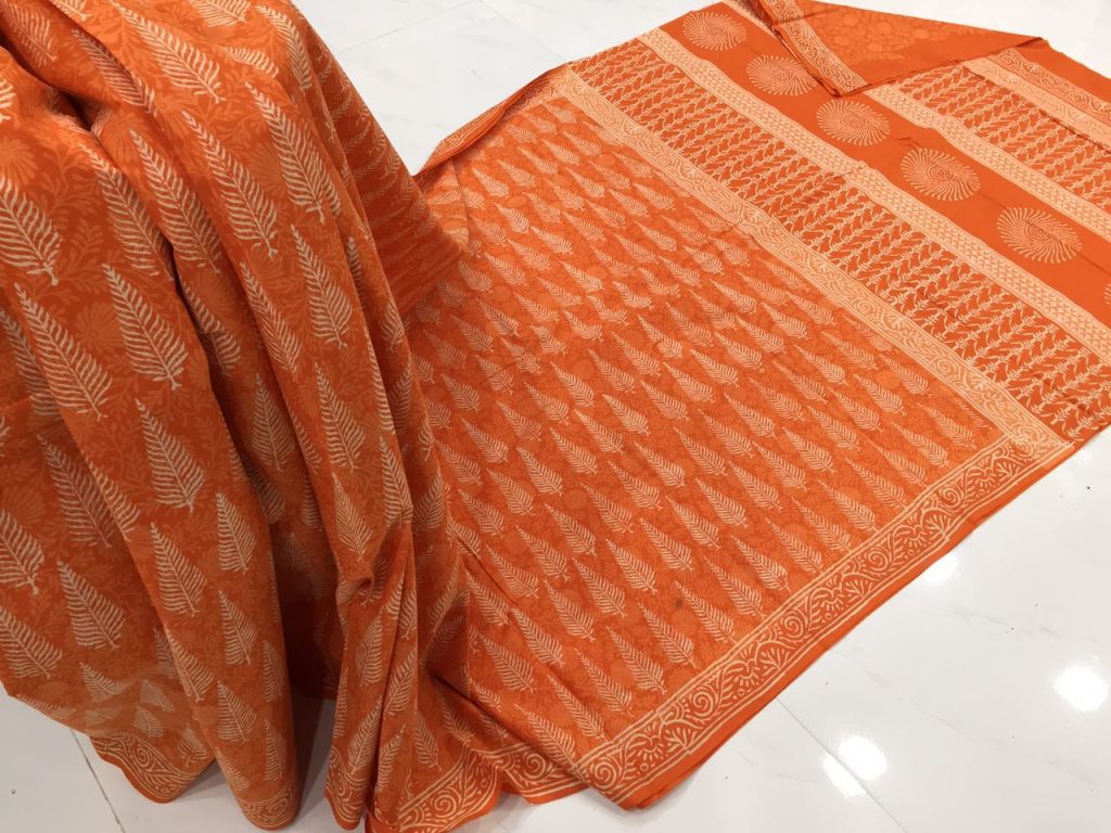 Discharge orange casual wear leaf bagru print cotton sarees with blouse piece