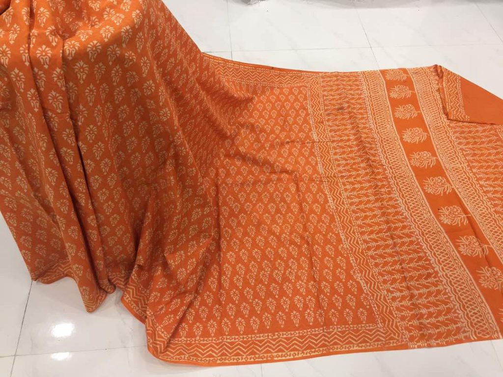 Discharge orange regular wear booty bagru print cotton sarees with blouse piece