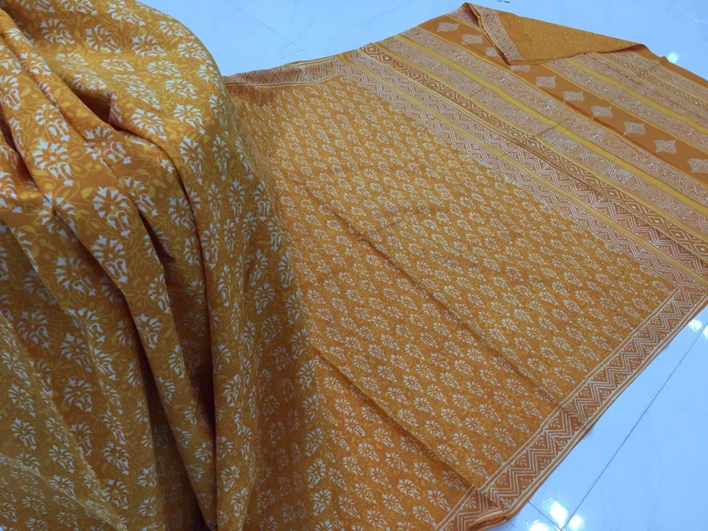 Jaipuri ocher casual wear booty bagru print cotton sarees with blouse piece