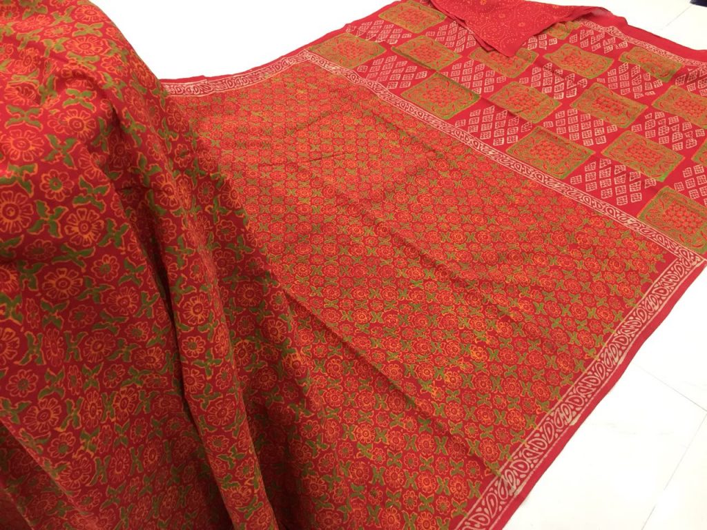Jaipuri orange red regular wear bagru print cotton sarees with blouse piece