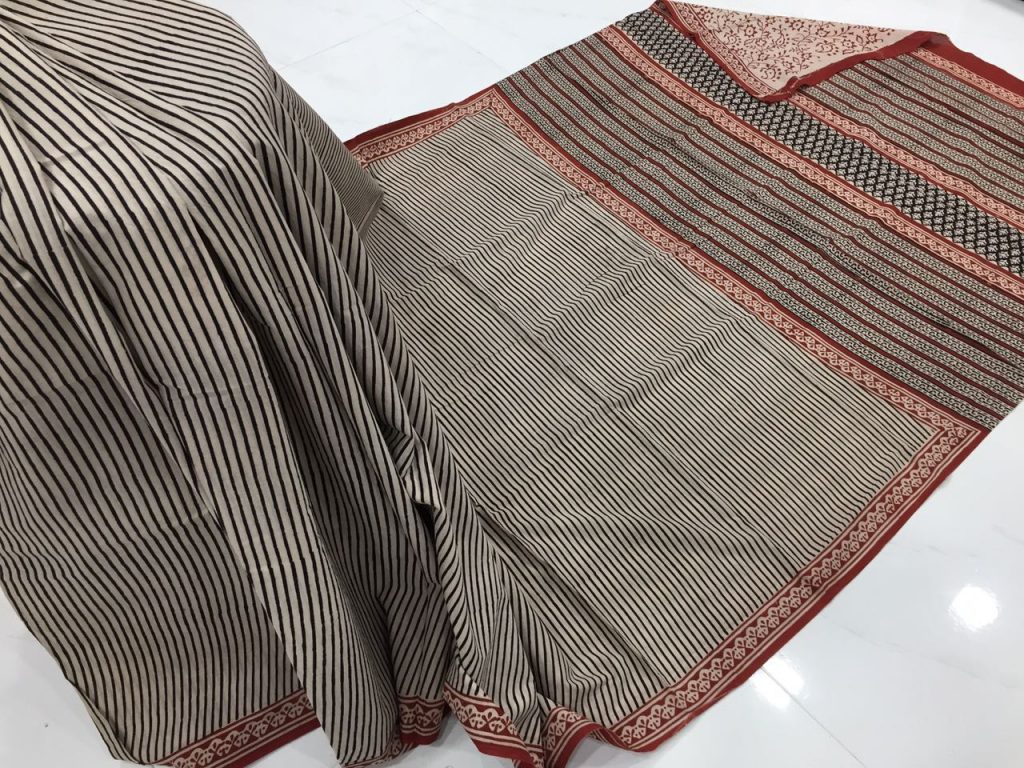 Exclusive champagne regular wear strips bagru print cotton sarees with blouse