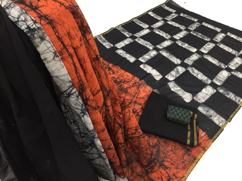 Orange black batik print regular wear zari border cotton mulmul saree with blouse