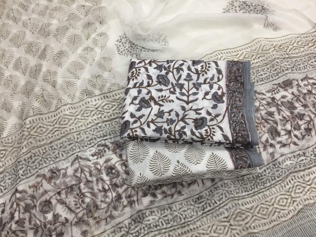 Unstitched white pigment print cotton salwar suit set with chiffon dupatta