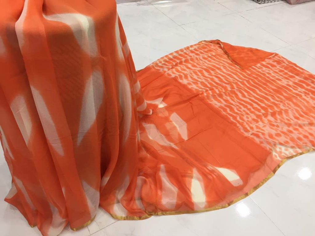 Orange casual wear chiffon saree with blouse piece