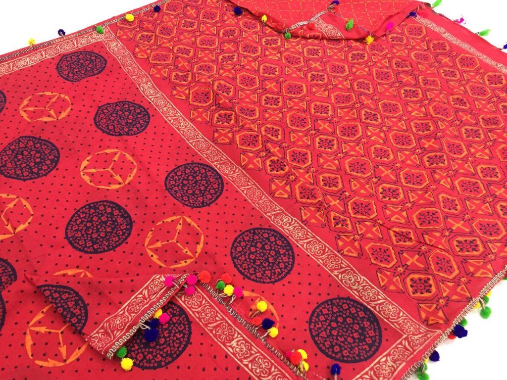 Orange red regular wear bagru print cotton mulmul pompom saree