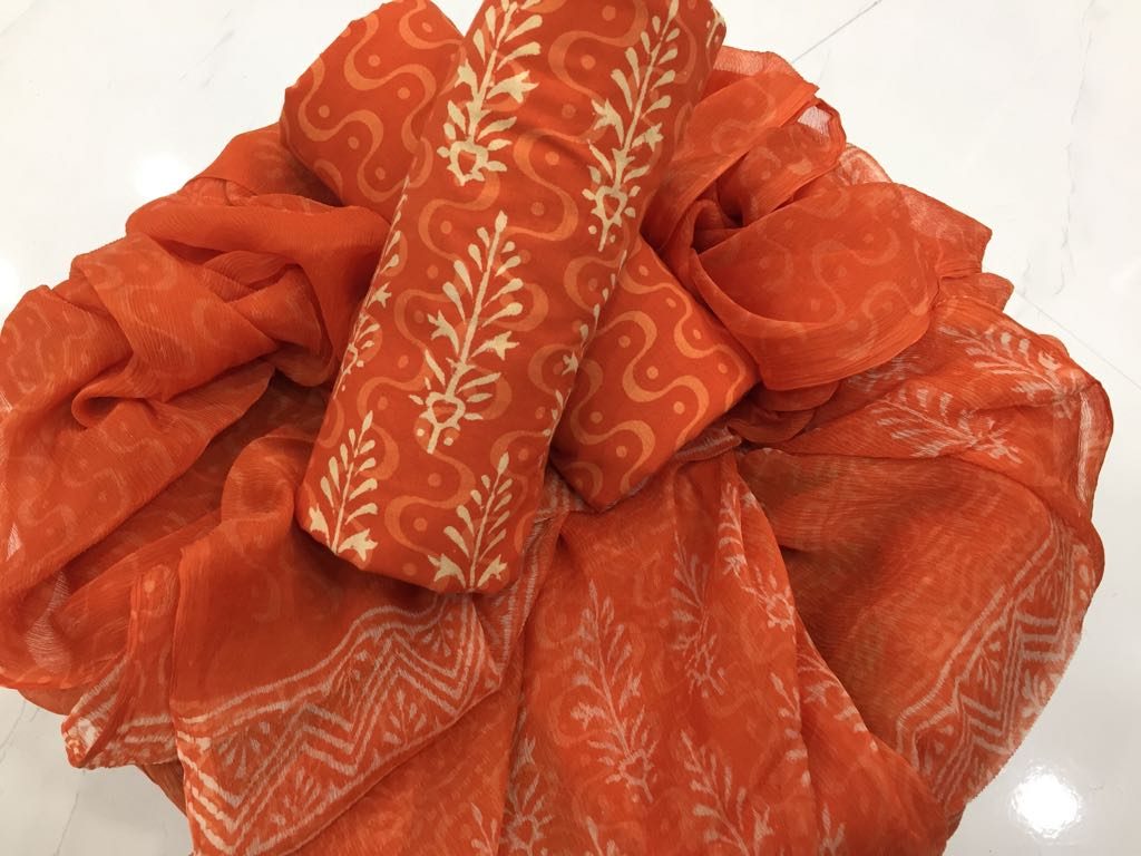 Unstitched orange-red bagru discharge print cotton salwar suit with chiffon dupatta