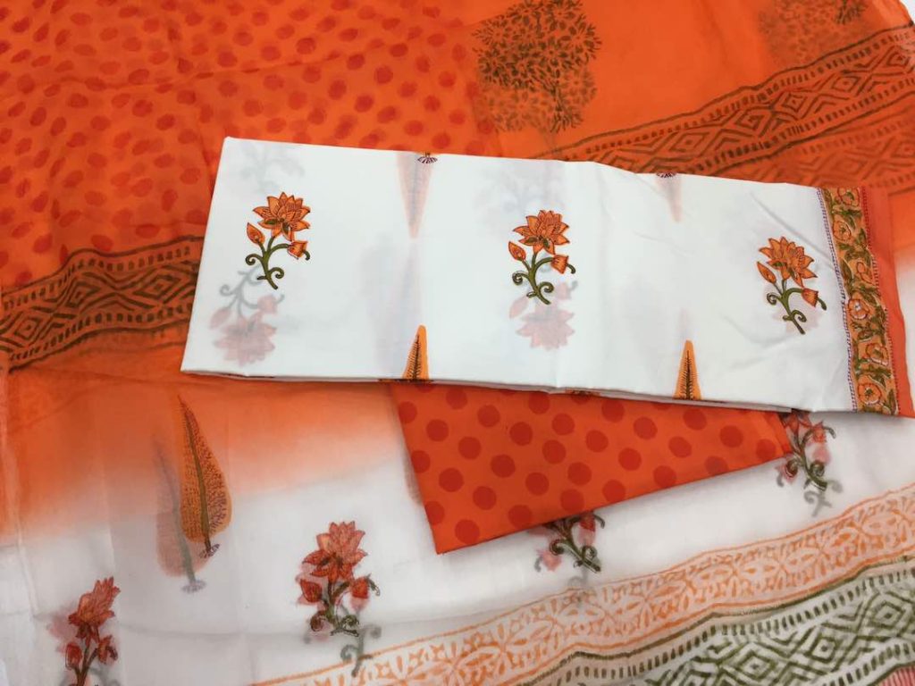 Traditional white orange-red mugal print cotton suit set with chiffon chunni