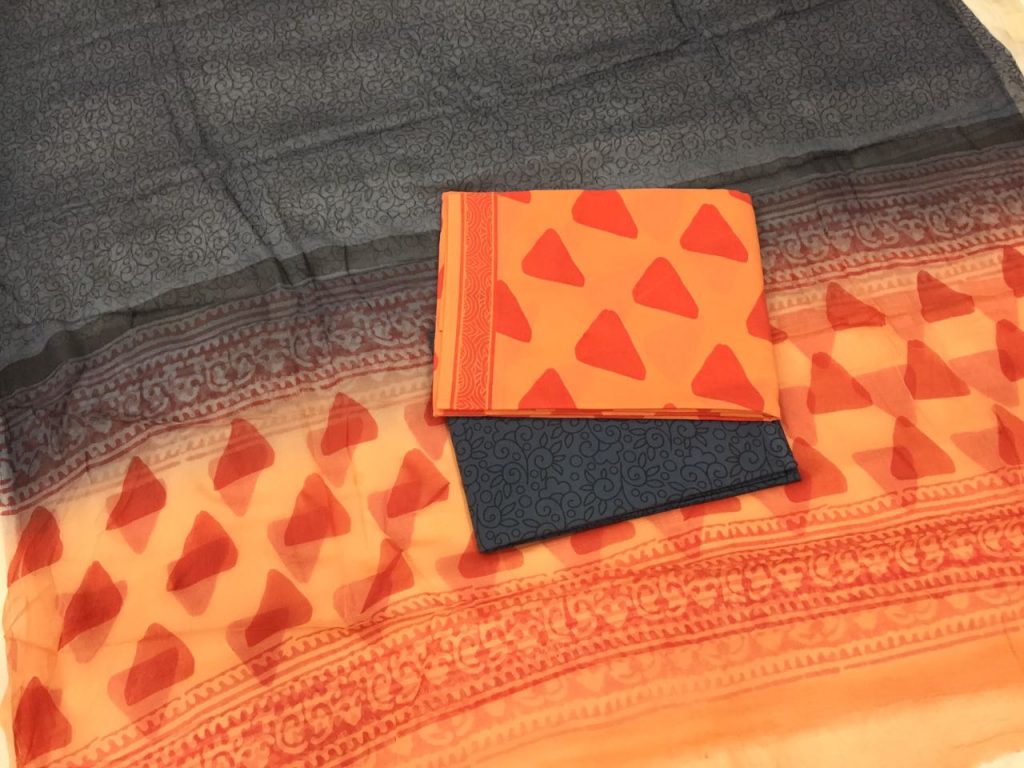 Orange triangle pigment print cotton salwar kameez set with chiffon chunni