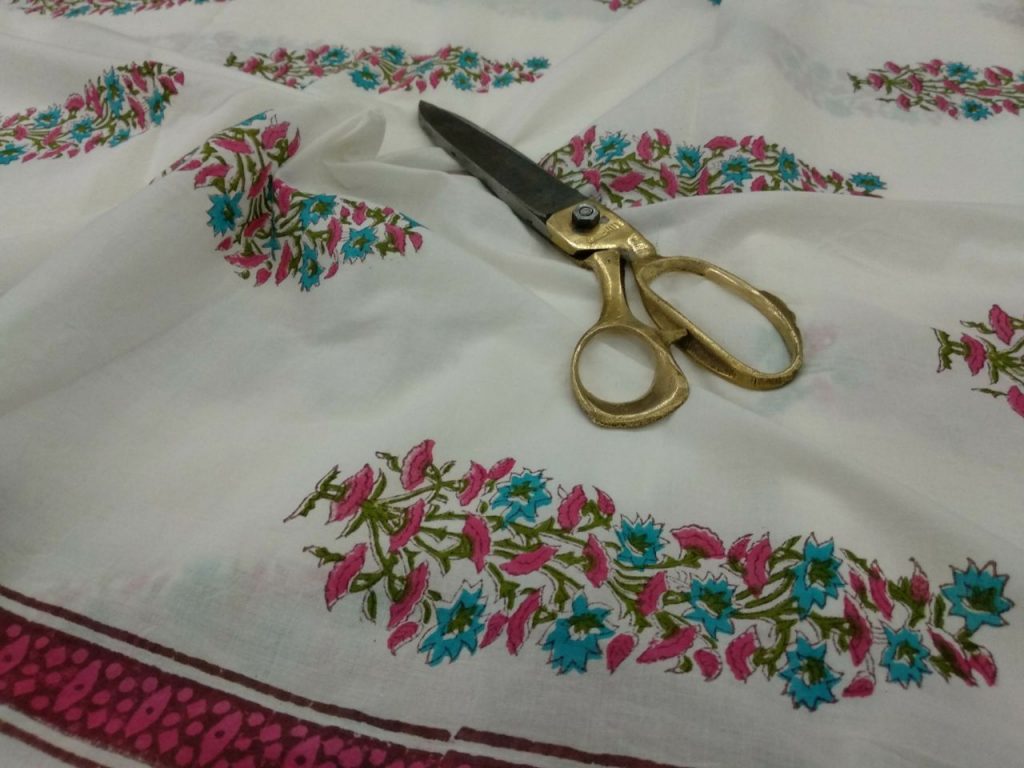 Unstitched white mughal print cotton running material