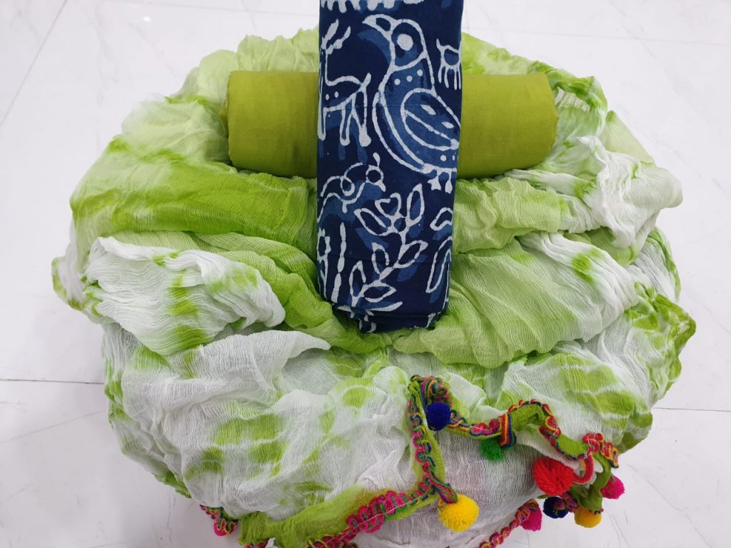 Pompom suit with indigo top and lime green dupatta