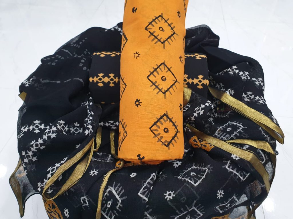 Beautiful zari border cotton suit in black and orange color
