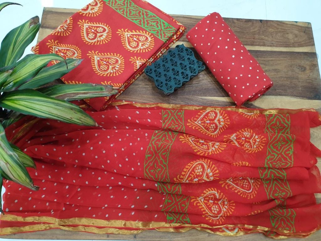 Red suit with yellow print zari border cotton suit