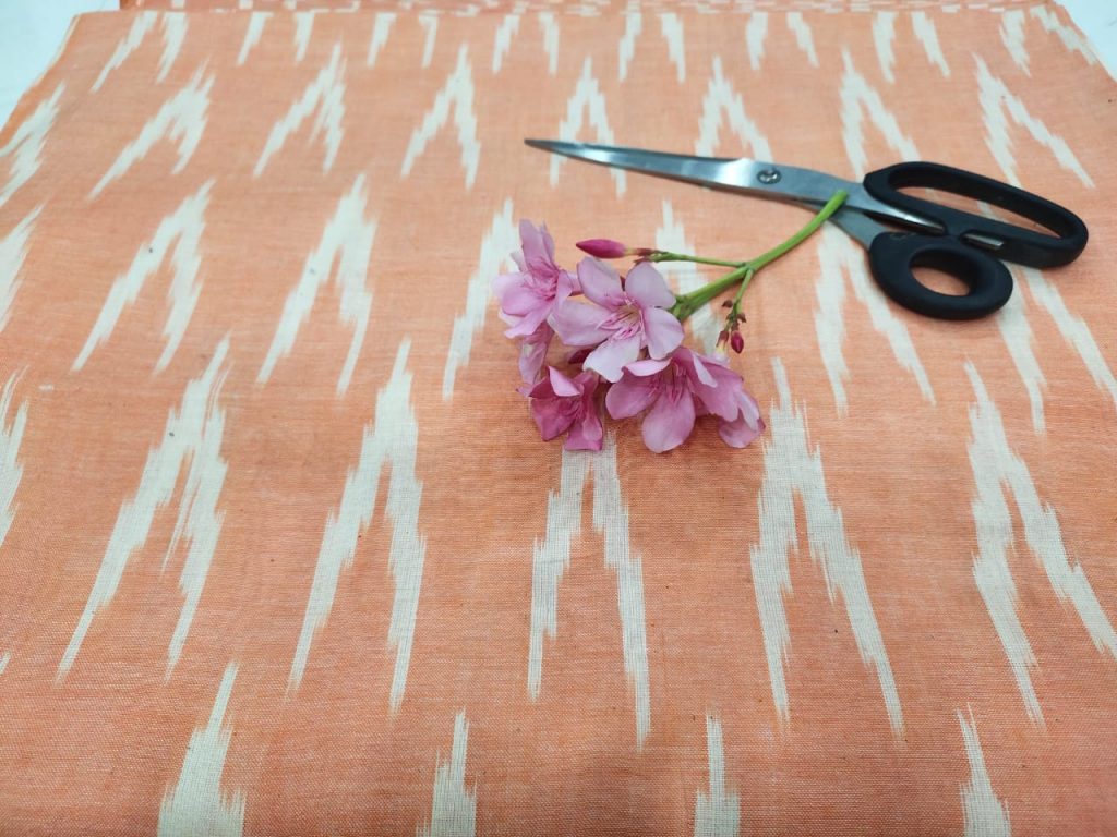 Medium Apricot ikkat running fabric for indian ethnic wear suit
