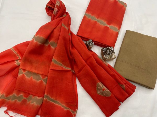 Orangish red bandhani print cotton suit with mulmul dupatta