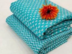 Printed cotton running material in Turquoise color