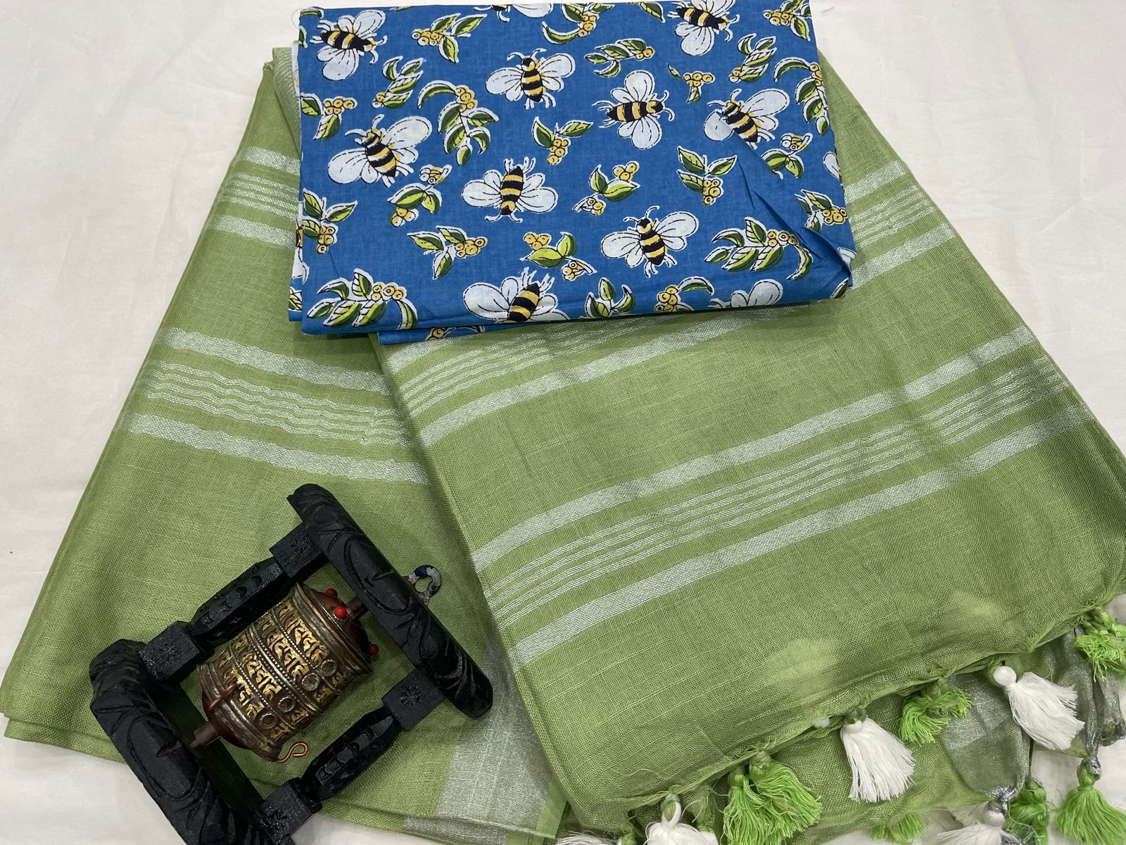 Olive green Plain Linen women saree online with silver zari border