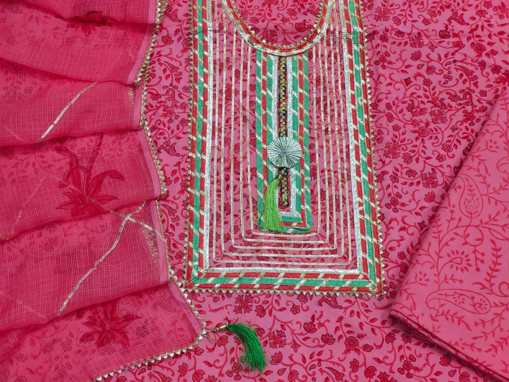 Cerise pink discharge print cotton embroidery design on salwar kameez by hand with kota doria dupatta