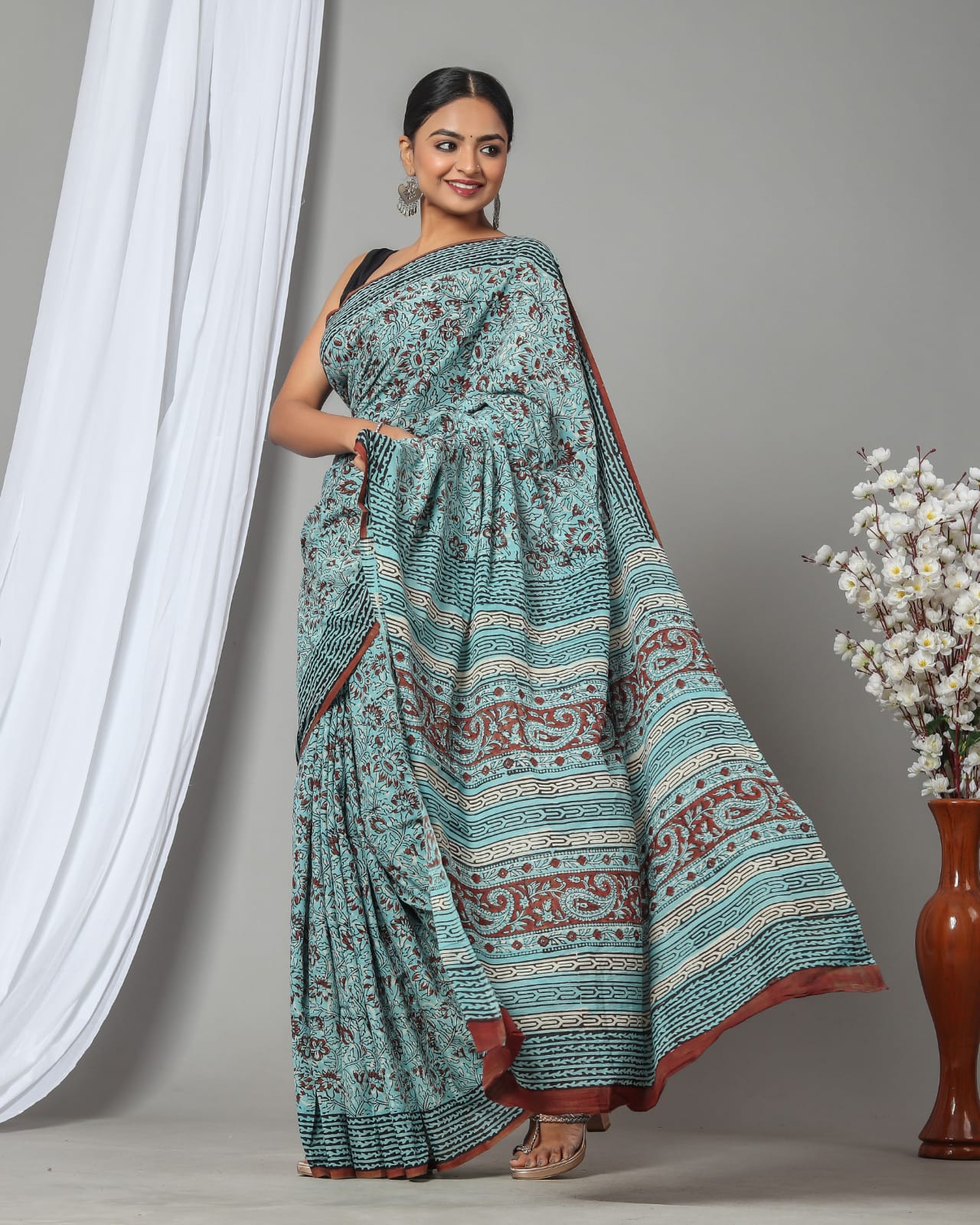 Turquoise blue hand printed cotton sarees