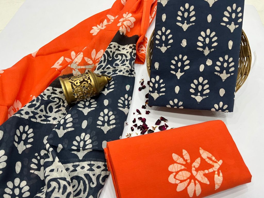 Orange cotton batik printed suit for ladies with mulmul dupatta