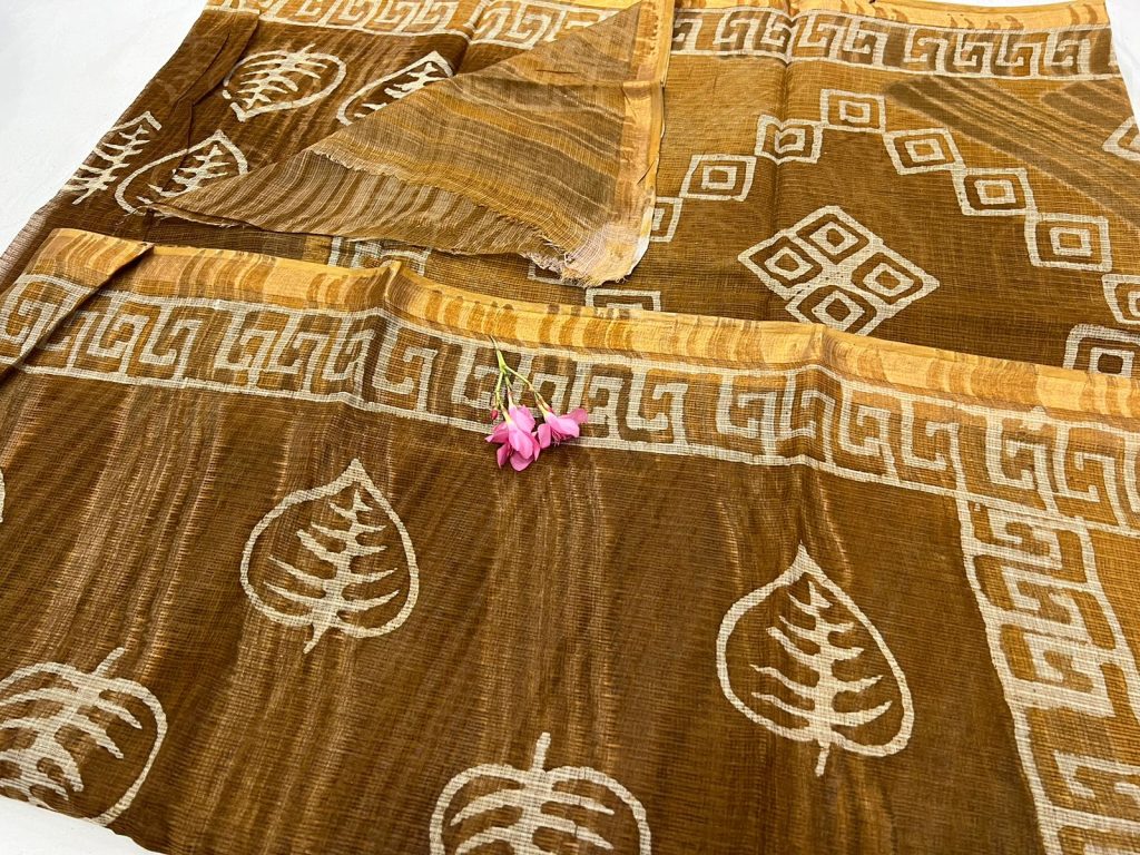 Copper brown block printed kota doria saree with zari border