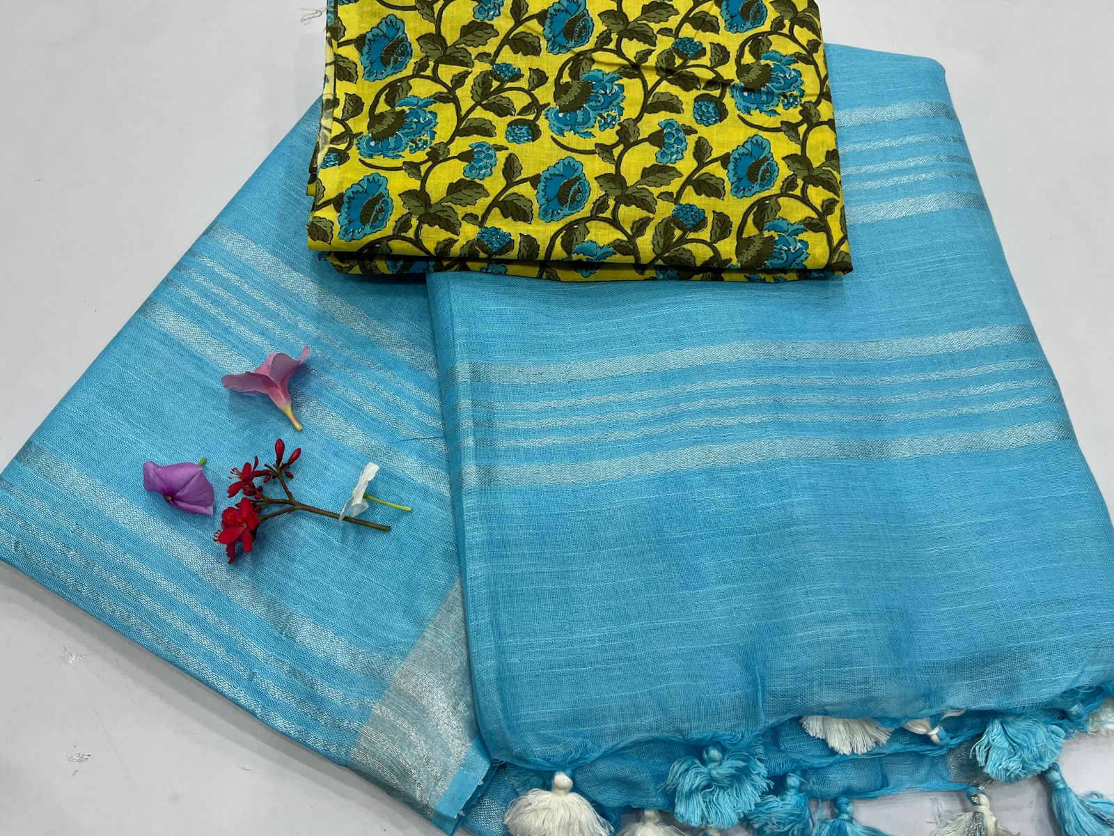 Vivid Sky Blue linen cotton sarees wholesale with yellow printed blouse