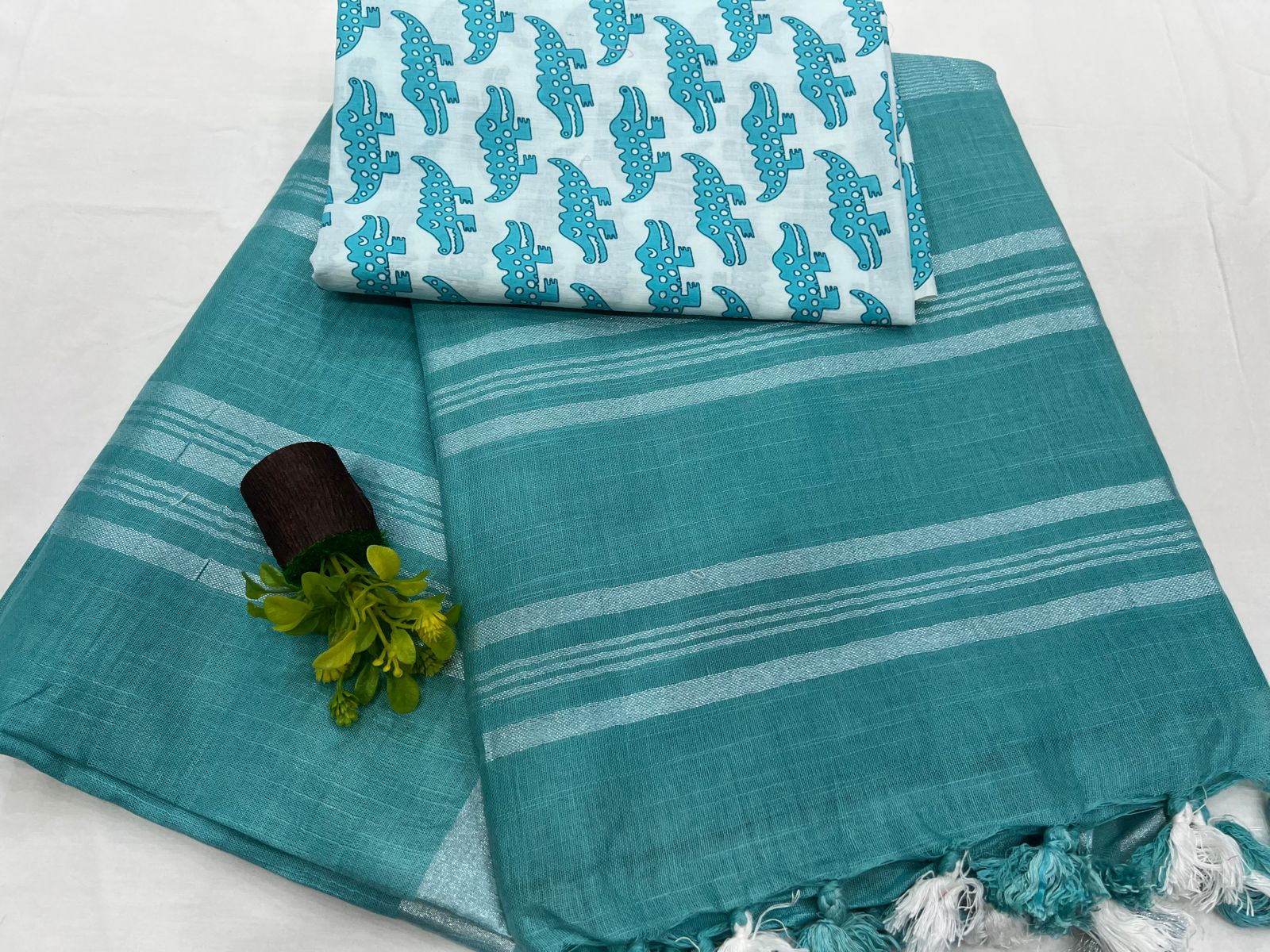 Teal green Plain linen saree with blouse animal print designs