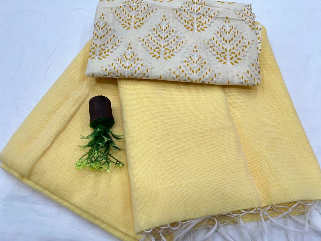 Canary yellow plain kota doria saree with white printed cotton blouse