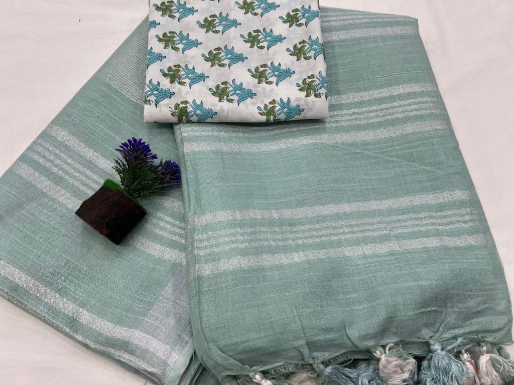 Caribbean Green linen sarees with cotton blouse printed designs