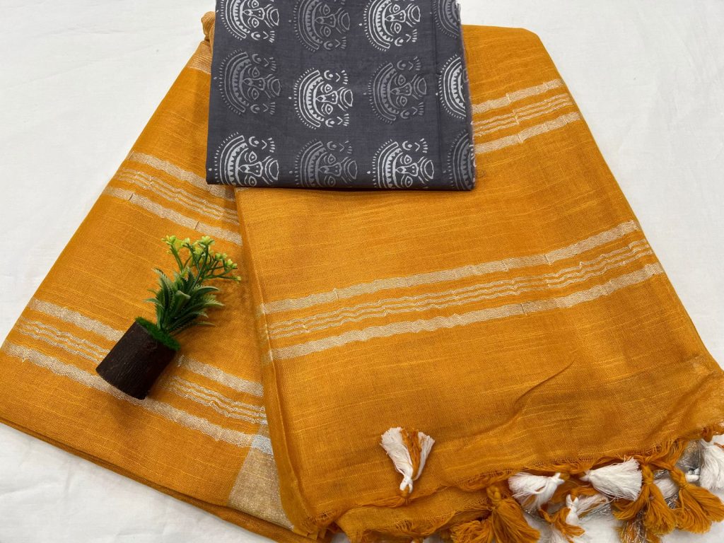 Amber color plain linen saree with gray blouse