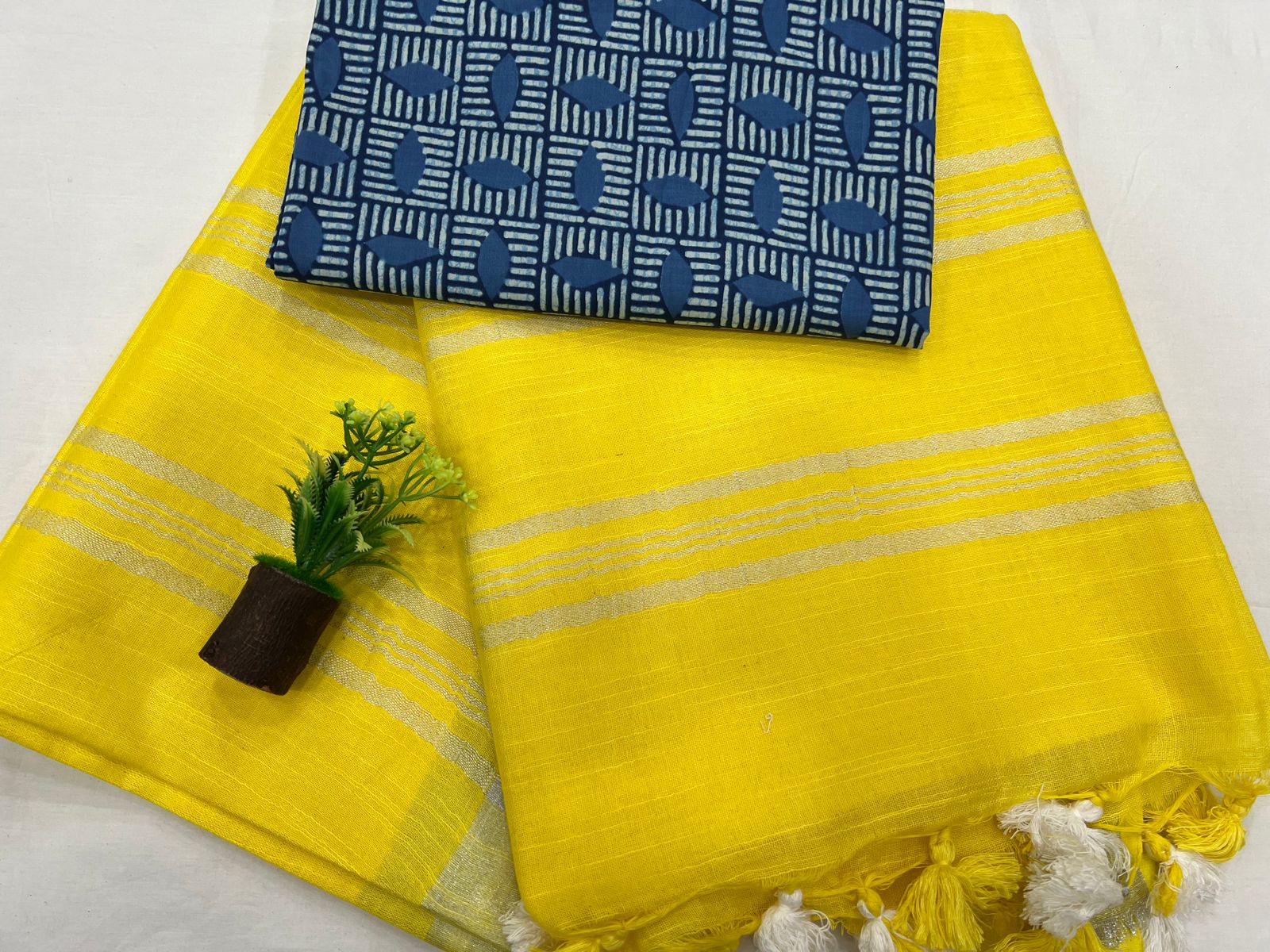 Bright yellow plain linen saree with printed blouse