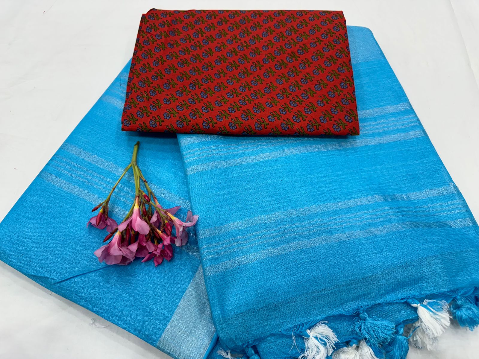 Blue plain linen saree with red cotton blouse