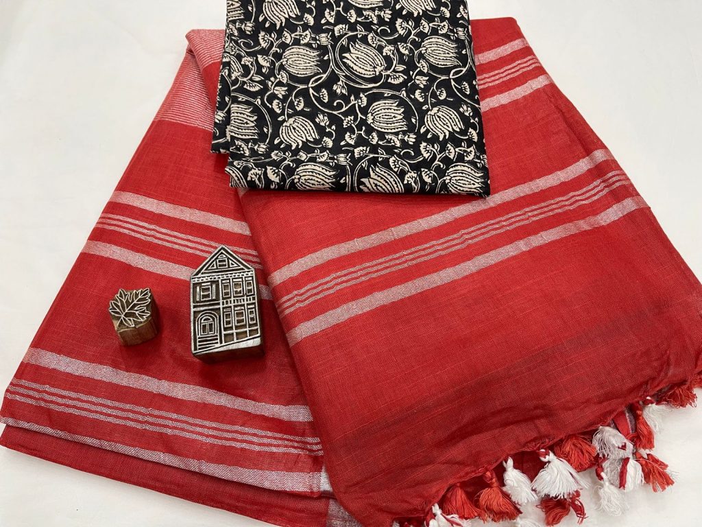 Red linen saree with black printed blouse