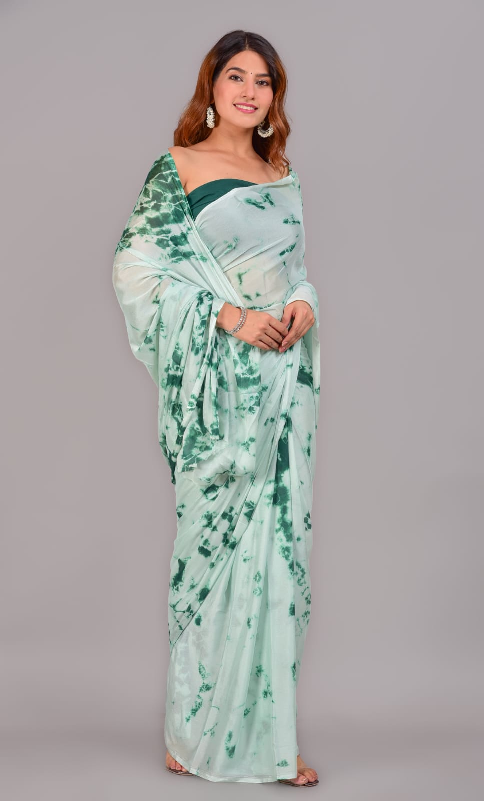 Printed turquoise green chiffon saree with blouse